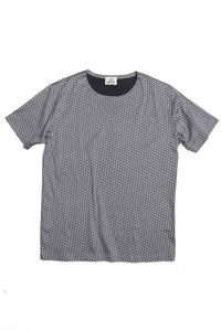 A short-sleeve crewneck t-shirt with a small white geometric pattern on a dark gray background, laid flat against a white background.