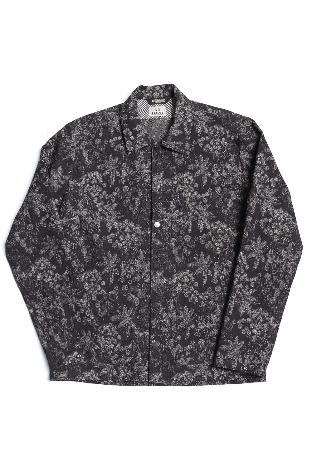 Black and navy Tapi Overshirt Denim Flower with blue floral pattern, button-up long sleeves, and classic collar, crafted from Italian luxury mill overstock fabric.