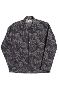 Black and navy Tapi Overshirt Denim Flower with blue floral pattern, button-up long sleeves, and classic collar, crafted from Italian luxury mill overstock fabric.